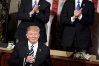 US President Donald Trump pauses for applause while speaking during a joint session of Congress on Capitol Hill February 28, 2017 in Washington, DC