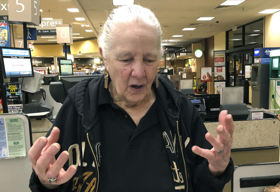 In this Jan. 10, 2019, photo, Ethel Sechlera talks about the effect of multiple aftershocks from Alaska's recent magnitude 7.0 earthquake in Anchorage, Alaska. The supermarket cashier finds the aftershocks unsettling, but believes they are a way for the ground to let off seismic pressures, reducing the risk of another big quake. (AP Photo/Rachel D'Oro)