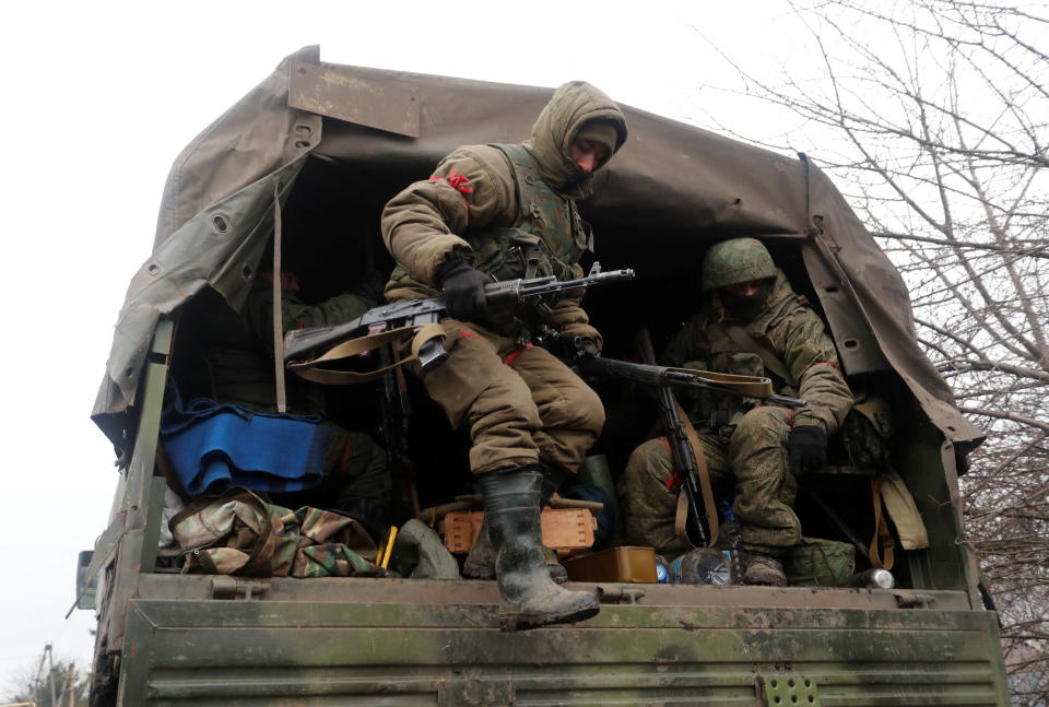 Service members of pro-Russian troops in uniforms without insignia are seen in a truck in the separatist-controlled settlement of Rybinskoye during Ukraine-Russia conflict in the Donetsk region, Ukraine March 5, 2022. REUTERS/Alexander Ermochenko