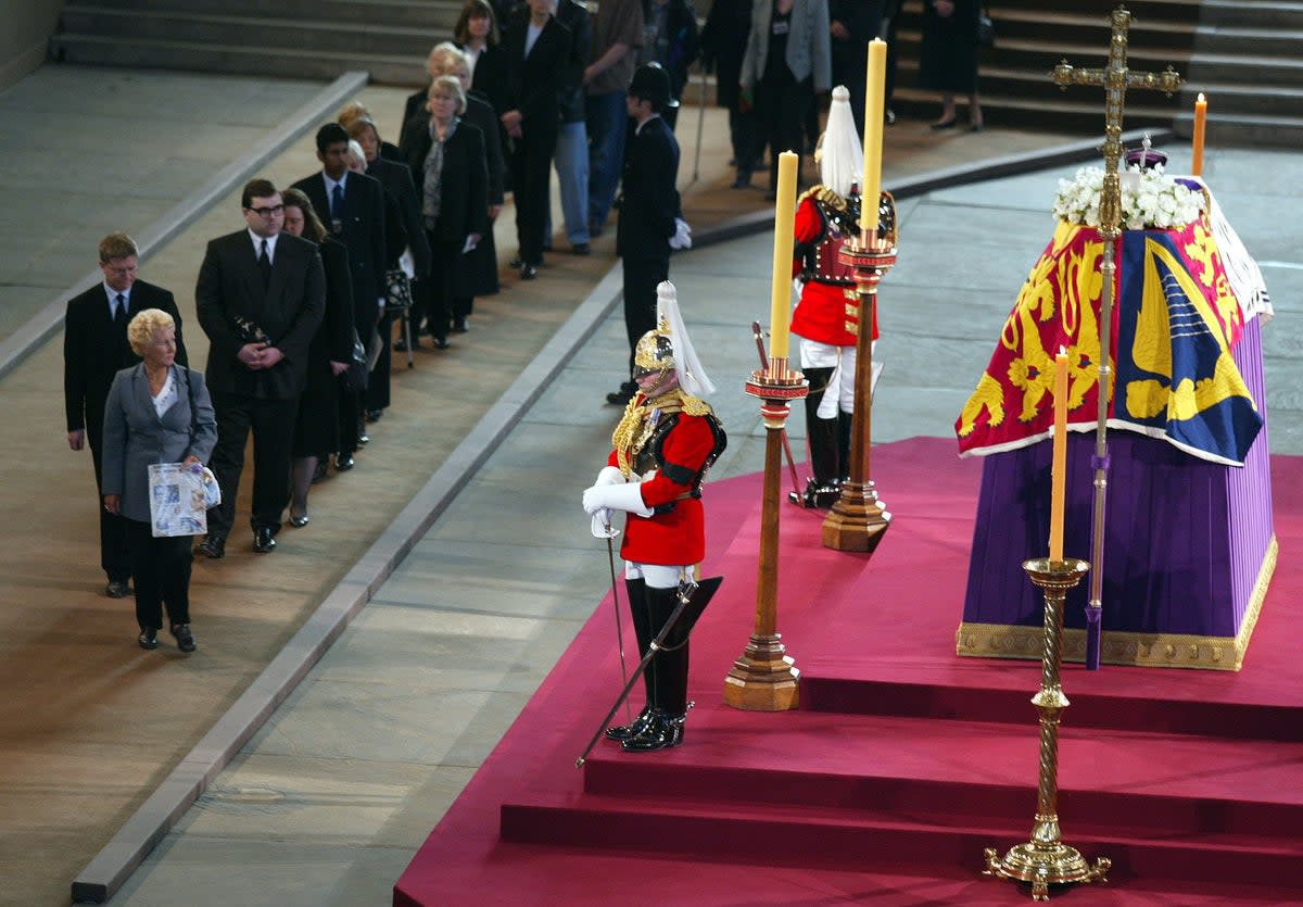 Mourners queue to file past the coffin of the Queen Mother (Phil Noble/PA) (PA Archive)