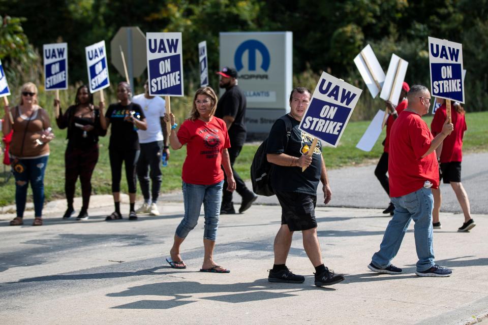 UAW Local 1248 members walk the picket line outside of a Stellantis plant in Romulus on Friday, Sept. 22, 2023.