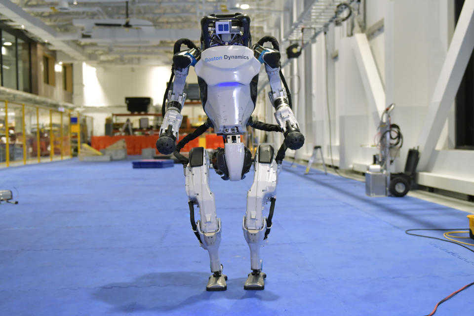 A Boston Dynamics Atlas robot performs a movement during a demonstration, Wednesday, Jan. 13, 2021, at the company's facilities in Waltham, Mass. The company engineered the robot to be able to dance in a fluid manner that is almost human. (AP Photo/Josh Reynolds)