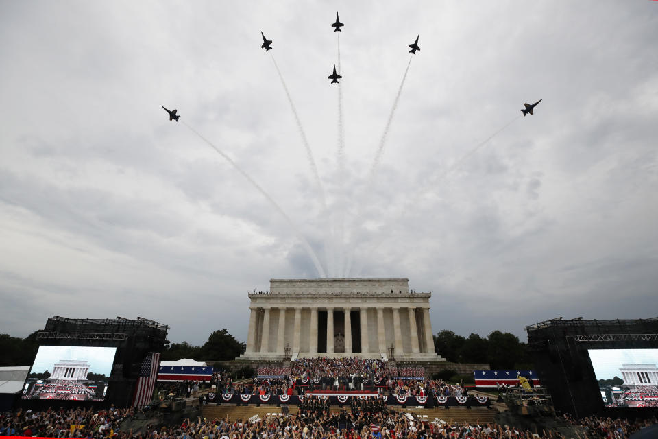 FILE - President Donald Trump, first lady Melania Trump, Vice President Mike Pence and Karen Pence and others stand as the US Army Band performs and the US Navy Blue Angels flyover at the end of an Independence Day celebration in front of the Lincoln Memorial, July 4, 2019, in Washington. (AP Photo/Alex Brandon, File)