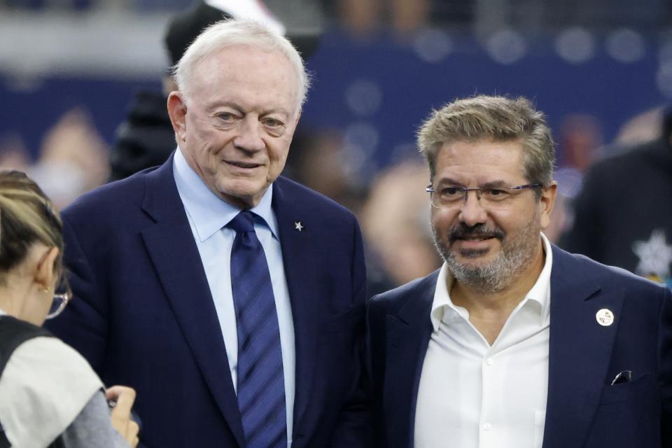 FILE - Dallas Cowboys team owner Jerry Jones and Dan Snyder, co-owner and co-CEO of the Washington Commanders, pose for a photo on the field during warmups before a NFL football game in Arlington, Texas, Sunday, Oct. 2, 2022. The Washington Commanders are denying the contents of a report by ESPN detailing Dan Snyder's efforts to influence other NFL owners and the league office to keep control of the team. In a statement sent to The Associated Press on Thursday, Oct. 13, a Commanders spokesperson called it “categorically untrue” and “clearly part of a well-funded, two-year campaign to coerce the sale of the team, which will continue to be unsuccessful.”(AP Photo/Michael Ainsworth, File)