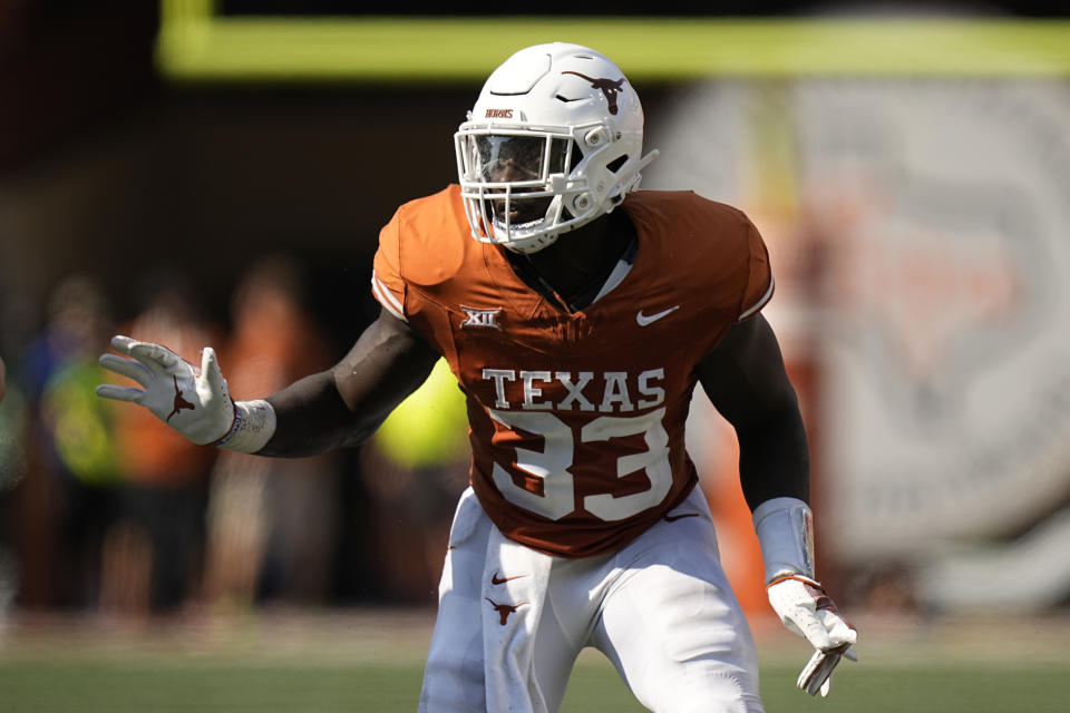 FILE - Texas linebacker David Gbenda (33) during the second half of an NCAA college football game against Rice, Sept. 2, 2023, in Austin, Texas. Texas is back — fourteen years after last playing for a national championship, Texas (12-1) is in the College Football Playoff as Big 12 champion. (AP Photo/Eric Gay, File)