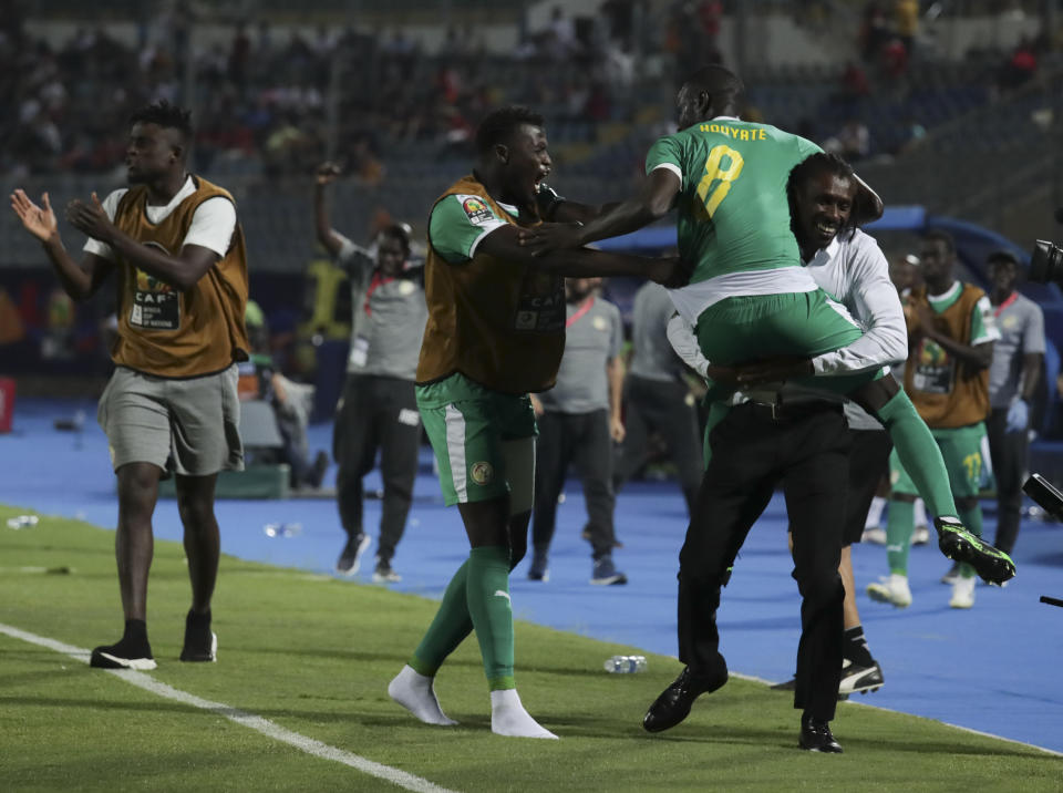 Senegal players celebrate after a goal during the African Cup of Nations semifinal soccer match between Senegal and Tunisia in 30 June stadium in Cairo, Egypt, Sunday, July 14, 2019. (AP Photo/Hassan Ammar)