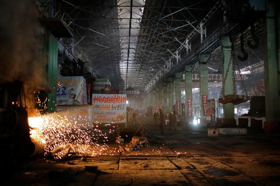 A shaft of light from a furnace shines through the Chollima Steel Complex in Nampo, North Korea, on Jan. 7, 2017. One of seven North Korean steel works, Chollima has more than 8,000 workers and is among the North's showcase enterprises.