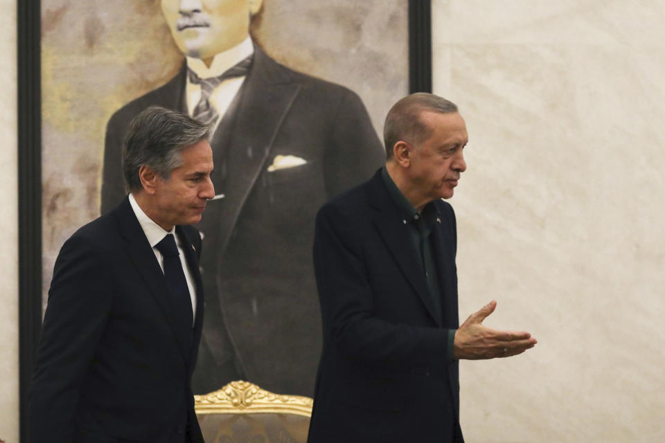 U.S. Secretary of State Antony Blinken, left, is lead by Turkish President Recep Tayyip Erdogan during their meeting at Esenboga airport in Ankara, Turkey, Monday, Feb. 20, 2023. Blinken is on his first trip to NATO ally Turkey since he was appointed two years ago. (AP Photo/Burhan Ozbilici, Pool)