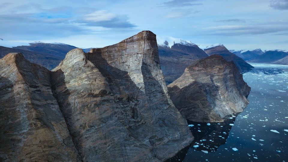 Ingmikortilaq mountain stands at a staggering 3,750 ft. - Matt Pycroft/National Geographic