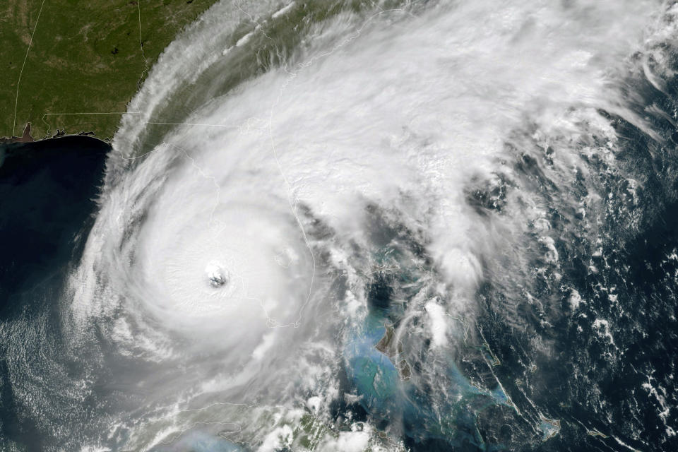 This GOES-East GeoColor satellite image taken at 12:01 a.m. EDT on Wednesday, Sept. 28, 2022, and provided by the National Oceanic and Atmospheric Administration (NOAA), shows the eye of Hurricane Ian approaching the southwest coast of Florida. Hurricane Ian's most damaging winds began hitting Florida's southwest coast Wednesday, lashing the state with heavy rain and pushing a devastating storm surge after strengthening to the threshold of the most dangerous Category 5 status. (NOAA via AP)