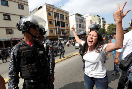 Opposition supporters clash with police in a rally against Venezuelan President Nicolas Maduro's government in Caracas, Venezuela March 9, 2019. REUTERS/Ivan Alvarado