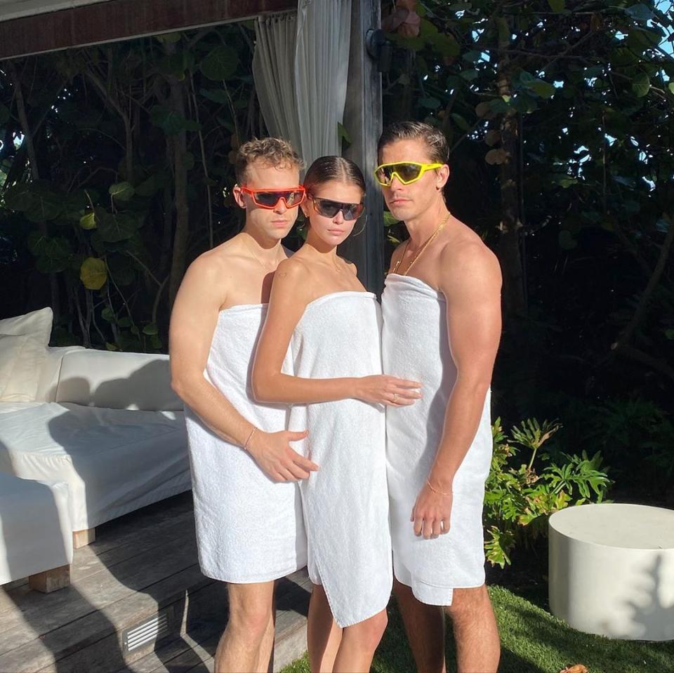 Kaia Gerber, Antoni Polowski, and Tommy Dorfman pose in towels