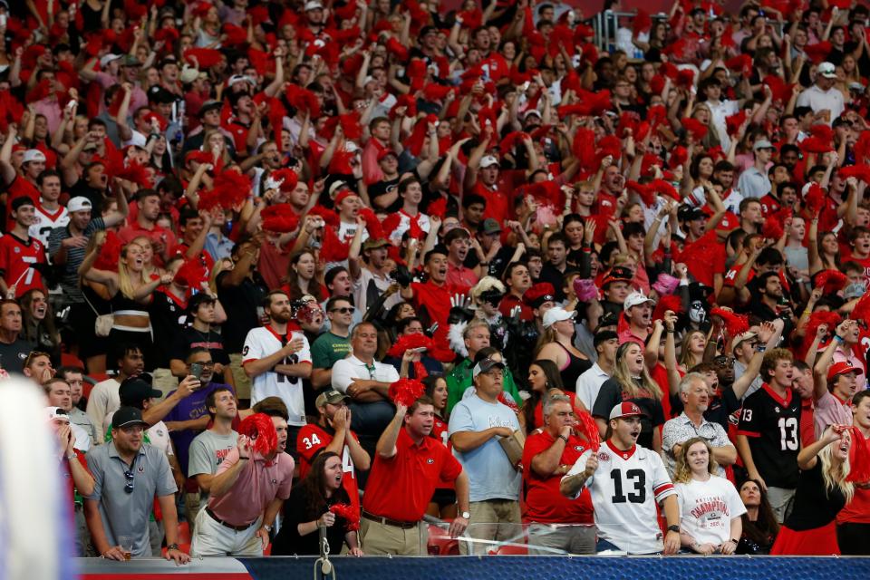 Georgia fans root on their team during the first half of the Chick-fil-A Kickoff NCAA college football game between Oregon and Georgia in Atlanta, on Saturday, Sept. 3, 2022.