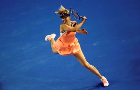 Russia's Maria Sharapova hits a shot during her second round match against Belarus' Aliaksandra Sasnovich at the Australian Open tennis tournament at Melbourne Park, Australia, January 20, 2016. REUTERS/Jason O'Brien