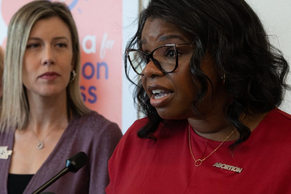 Chris Love (right, Planned Parenthood of Arizona) speaks during an Arizona for Abortion Access news conference on Sept. 21, 2023, at the law offices of Coppersmith Brockelman in Phoenix.
