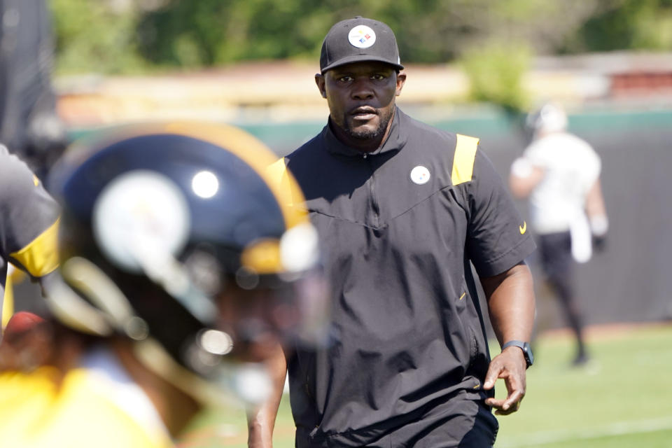 FILE - Pittsburgh Steelers senior defensive assistant Brian Flores, right, watches as the team goes through drills during an NFL football practice on May 31, 2022, in Pittsburgh. A judge on Thursday, Aug. 4, 2022, quickened the time it will take to rule whether NFL Commissioner Roger Goodell gets to decide the merits of racial discrimination claims made by Black coaches against the league and its teams, saying that it appears an effort to gather more evidence is a try at “an impermissible fishing expedition.” Flores, who was fired in January as head coach of the Miami Dolphins and is now with the Steelers, filed the lawsuit in February. (AP Photo/Keith Srakocic, File)