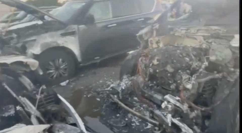 The burnt out remains of vehicles rented for Joe Biden’s visit to Nantucket that burst into flames (Nantucket Current / Twitter)