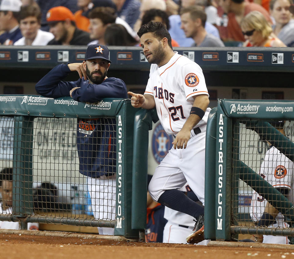 HOUSTON, TX - AUGUST 22:  Jose Altuve #27 of the Houston Astros and Mike Fiers #54 talk at Minute Maid Park on August 22, 2015 in Houston, Texas.  (Photo by Bob Levey/Getty Images)