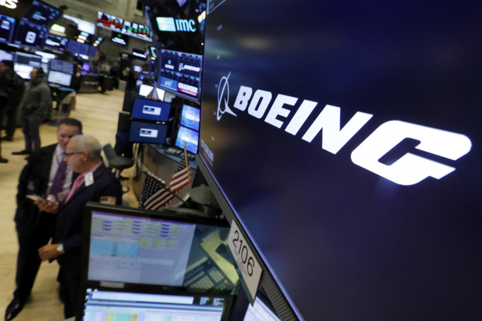 FILE - The logo for Boeing appears above a trading post on the floor of the New York Stock Exchange on Oct. 24, 2018. Boeing said Friday, March 3, 2023, that they rewarded their CEO David Calhoun with compensation valued at $22.5 million for 2022 but won’t pay him a $7 million bonus because the company will fail to get its new 777X jetliner in service by the end of this year. (AP Photo/Richard Drew, File)