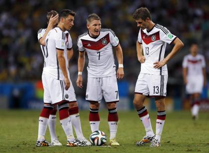 Mesut Ozil, Toni Kroos, Miroslav Klose and Thomas Mueller contemplate a free kick during Germany's draw with Ghana. (AP)