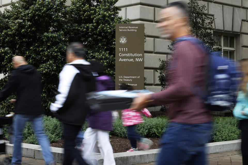 Tourists walk past the headquarters of the Internal Revenue Service in Washington, D.C. (Chip Somodevilla / Getty Images file)