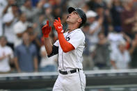 Detroit Tigers designated hitter Kerry Carpenter reacts at home plate after hitting a home run against Chicago Cubs starting pitcher Javier Assad in the sixth inning of a baseball game, Monday, Aug. 21, 2023, in Detroit. (AP Photo/Jose Juarez)