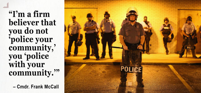 Police stand guard before the mandatory midnight curfew in Ferguson (Photo: Scott Olson/Getty Images)