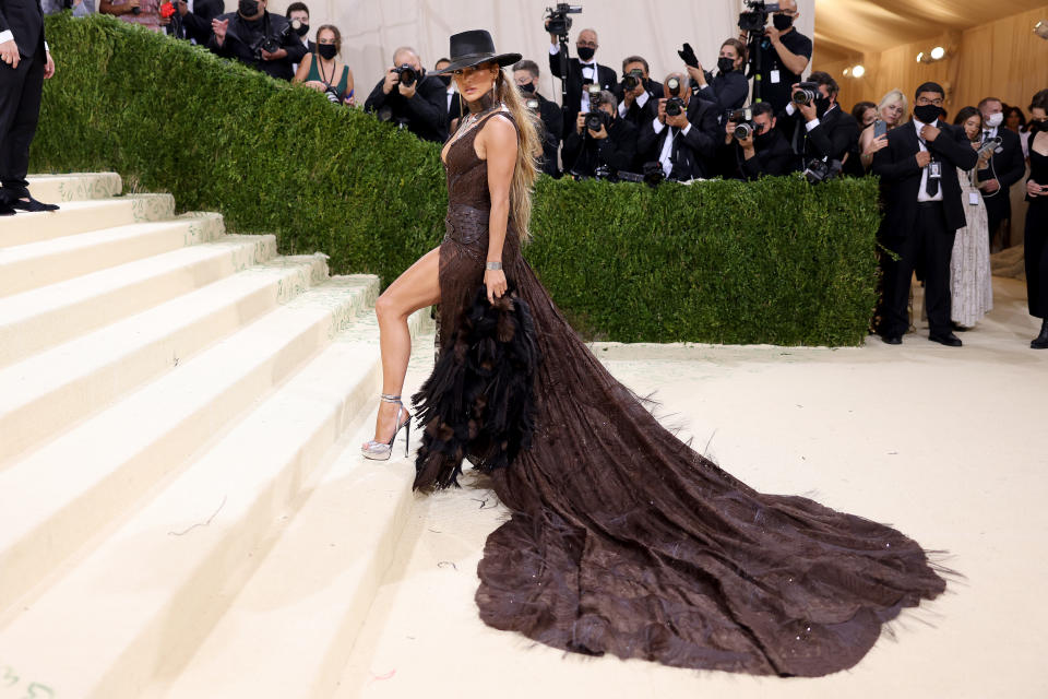 Jennifer Lopez wears a brown Ralph Lauren dress at The 2021 Met Gala Celebrating In America: A Lexicon Of Fashion at Metropolitan Museum of Art on September 13, 2021 in New York City.