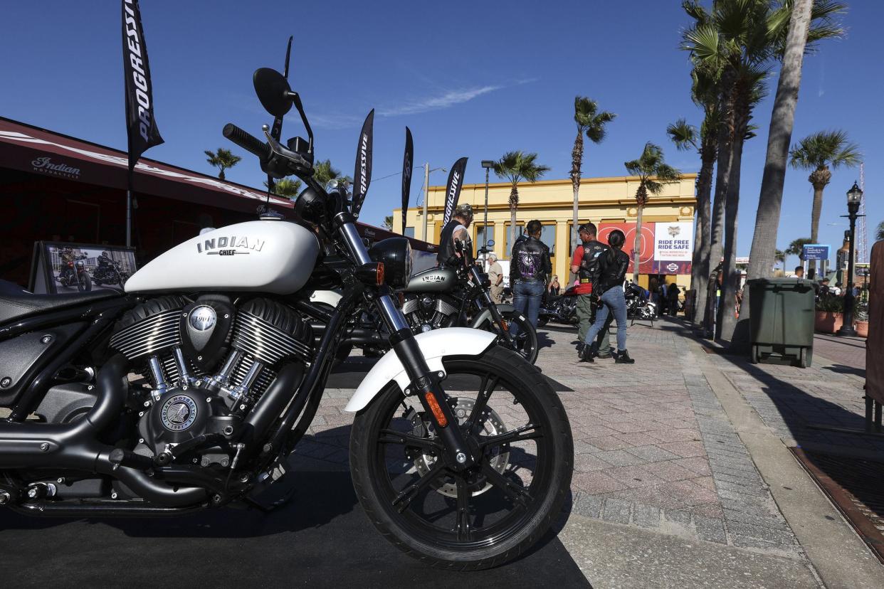 People look at bikes at the Indian Motorcycle Main Street display in Daytona, FL during the starting day of Bike Week on March 5, 2021. (Sam Thomas/Orlando Sentinel)