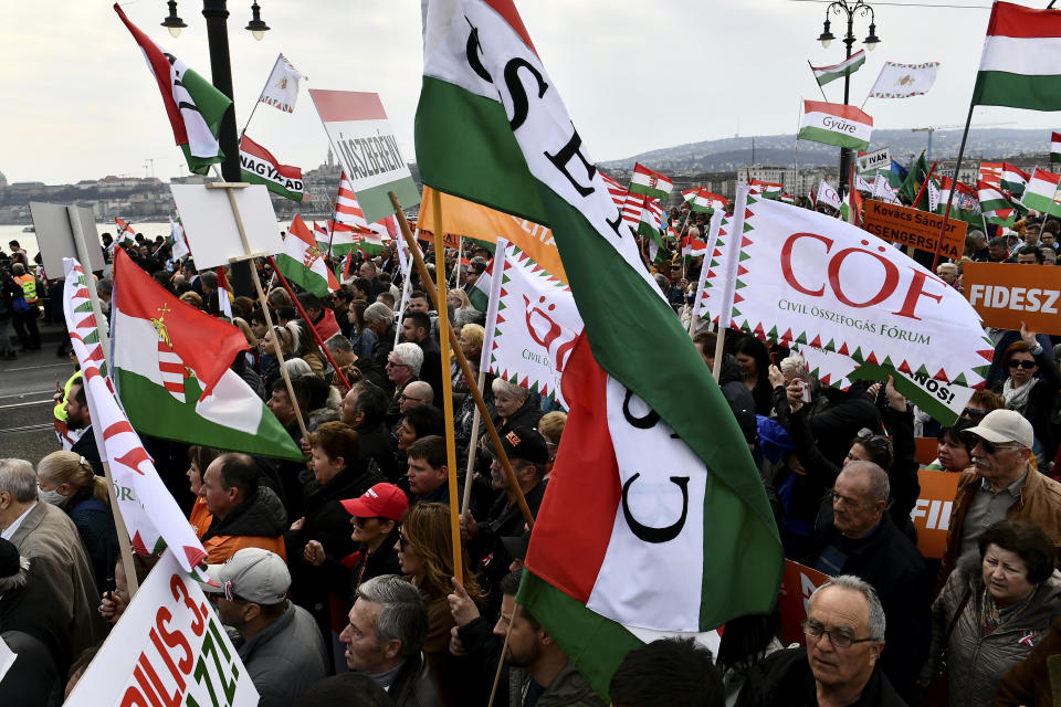 Thousands of supporters of Hungary's right-wing populist prime minister, Viktor Orban, gather in Budapest, Hungary, Tuesday, March 15, 2022. The so-called "peace march" was a show of strength by Orban's supporters ahead of national elections scheduled for April 3, while a coalition of six opposition parties also held a rally in the capital. (AP Photo/Anna Szilagyi)