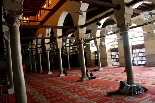 Spiritual Awakening: A man catches up on rest at Al Azhar Mosque.