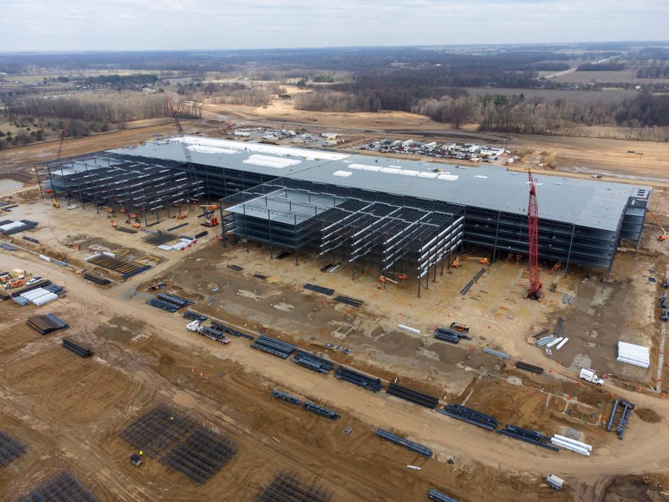 Construction is proceeding rapidly on a multi-story distribution facility that Amazon is building in Elkhart along the Indiana Toll Road. It'll need 1,000 employees beginning next year.