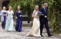 <p>Around the mid-2000s, it became more common for the maid of honor to wear a different color than the rest of the bridal party. Here, Lady Davina Windsor's MOH wears teal, while the rest of her party is in violet. </p>