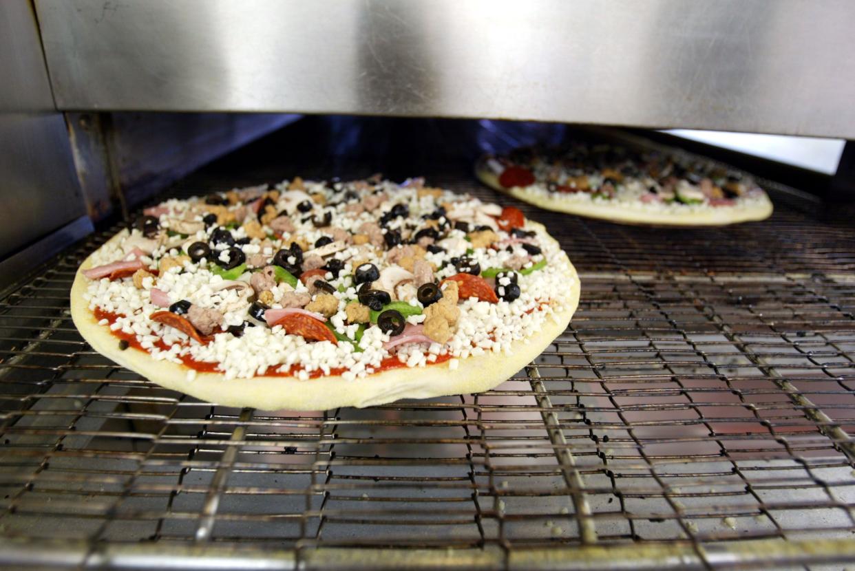 Domino's Pizza is baked April 14, 2004 in Miami, Florida