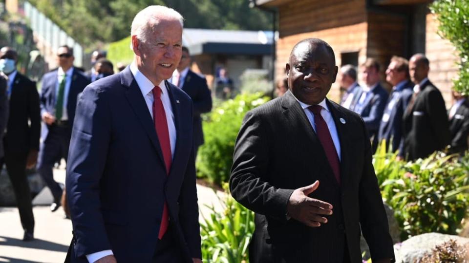 US President Joe Biden talks with South Africa’s President Cyril Ramaphosa at the G7 summit in Carbis Bay on June 12, 2021 in Carbis Bay, Cornwall. (Photo by Leon Neal/Getty Images)
