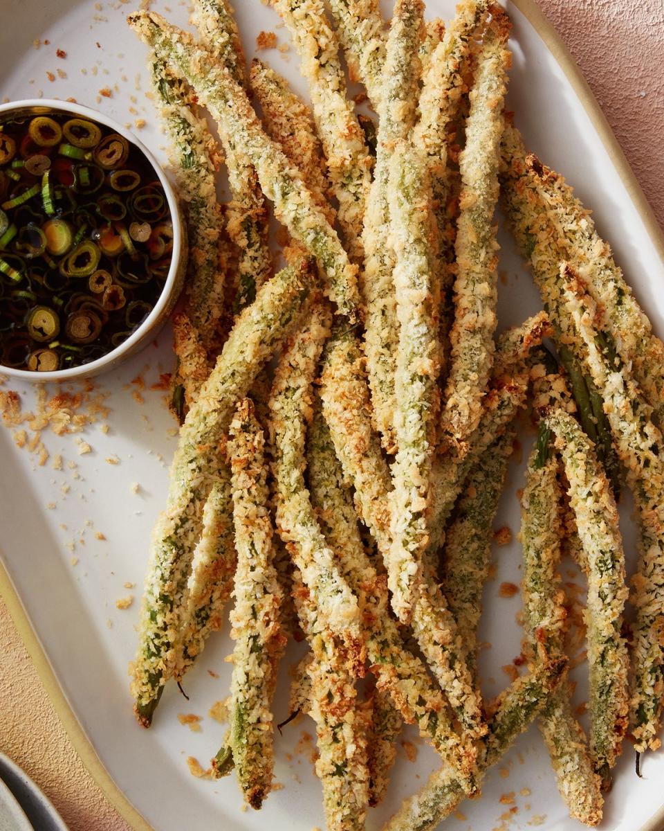 <p>Here, we set out to make crispy delicious tempura <a href="https://www.delish.com/cooking/a23089260/how-to-cook-green-beans/" rel="nofollow noopener" target="_blank" data-ylk="slk:green beans;elm:context_link;itc:0;sec:content-canvas" class="link ">green beans</a> minus the deep frying. Our solve? Panko breadcrumbs, which give the benefit of tempura's delicious crunch, without the need for a pot of hot, spattering oil or a <a href="https://www.delish.com/cooking/recipe-ideas/a31750708/tempura-batter-recipe/" rel="nofollow noopener" target="_blank" data-ylk="slk:classic tempura batter;elm:context_link;itc:0;sec:content-canvas" class="link ">classic tempura batter</a> (since wet batters don't do well in the air fryer).</p><p>Get the <strong><a href="https://www.delish.com/cooking/recipe-ideas/a39721263/air-fryer-tempura-recipe/" rel="nofollow noopener" target="_blank" data-ylk="slk:Air Fryer Tempura-Inspired Green Beans recipe;elm:context_link;itc:0;sec:content-canvas" class="link ">Air Fryer Tempura-Inspired Green Beans recipe</a></strong>.</p>