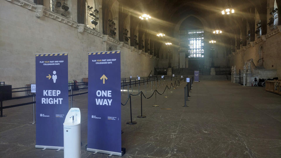 The queuing system which has been put in place at Westminster Hall in the Palace of Westminster for MPs to line up for the vote on the government's plans to force all MPs to vote in person, in London, Tuesday June 2, 2020. Like many other Britons, U.K. lawmakers have largely been working from home during the coronavirus pandemic. Now they are being summoned back to the office and many aren’t happy. They say the government’s decision to scrap a remote-voting system used during the pandemic will turn those who must stay home because of age, illness or family issues into second-class lawmakers. (George Ryan/PA via AP)