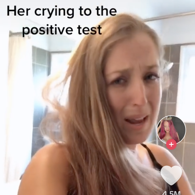 Woman with surprised expression possibly reacting to a positive pregnancy test