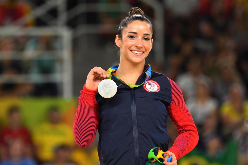 Aly Raisman poses with one of her silver medals at the 2016 Rio Olympics. She finished second in the all-around and floor competitions.