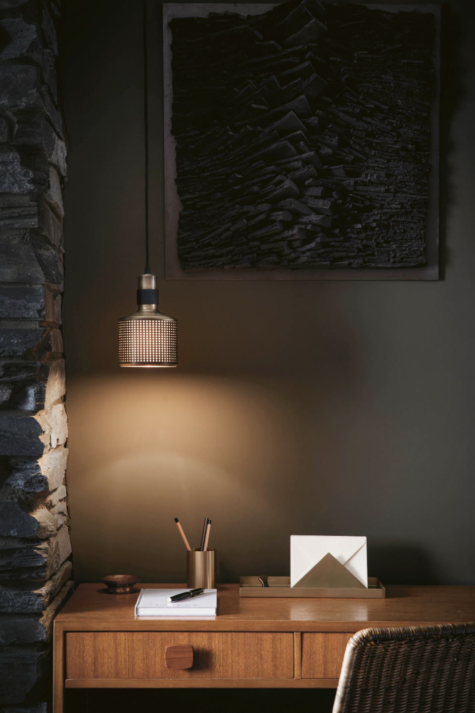 A study table with a lighting piece above it