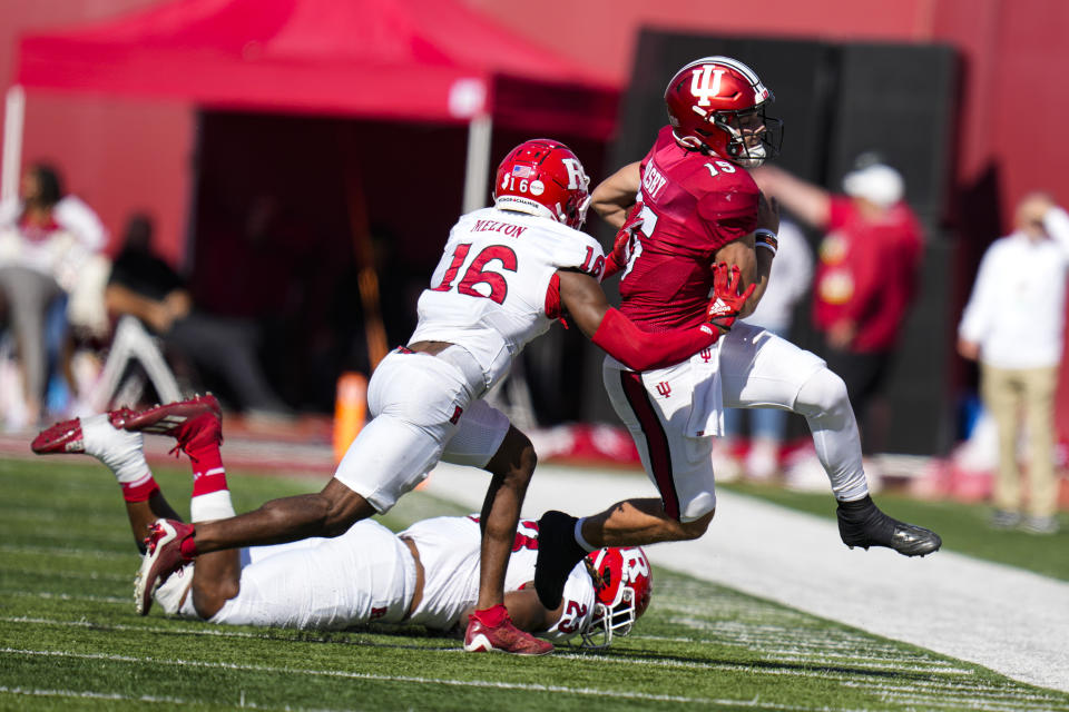 Indiana quarterback Brendan Sorsby (15) is knocked out of bounds by Rutgers defensive back Max Melton (16) during the second half of an NCAA college football game in Bloomington, Ind., Saturday, Oct. 21, 2023. Rutgers defeated Indiana 31-14. (AP Photo/Michael Conroy)