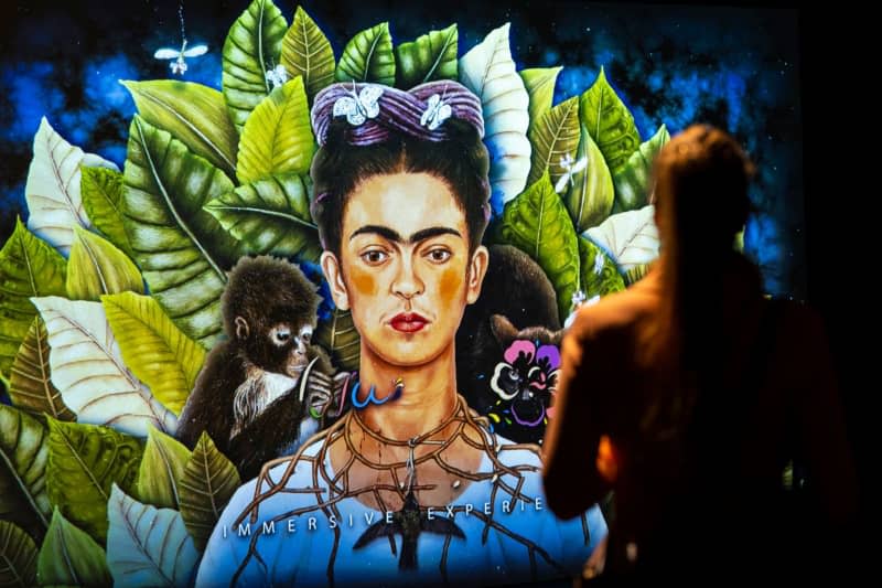 An immersive show about Mexican painter Frida Kahlo, promising a visually powerful multimedia journey through her art and life. Lennart Preiss/dpa