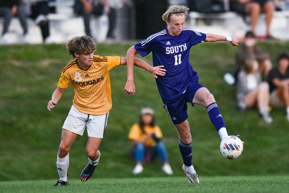 Bloomington South’s Landon Ryner (11) controls the ball against Bloomington North’s Tristan Larson during their boys’ soccer match at South on Thursday, September 14, 2023.