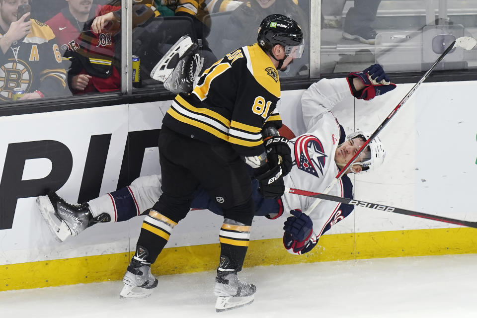 Boston Bruins defenseman Dmitry Orlov (81) and Columbus Blue Jackets center Jack Roslovic (96) collide during the second period of an NHL hockey game Thursday, March 30, 2023, in Boston. (AP Photo/Steven Senne)