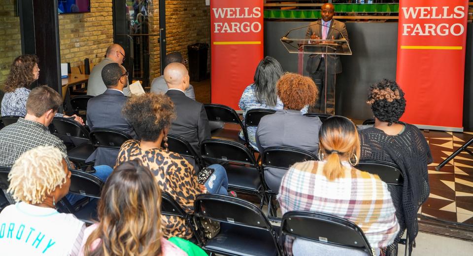 The audience listens as Milwaukee Mayor Cavalier Johnson delivers a speech during the launch of an initiative to help provide more affordable homes for families in Milwaukee.