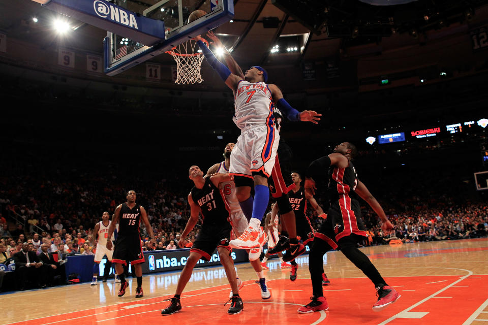 NEW YORK, NY - APRIL 15: Carmelo Anthony #7 of the New York Knicks lays the ball up against the Miami Heat at Madison Square Garden on April 15, 2012 in New York City. NOTE TO USER: User expressly acknowledges and agrees that, by downloading and/or using this Photograph, user is consenting to the terms and conditions of the Getty Images License Agreement. (Photo by Chris Trotman/Getty Images)