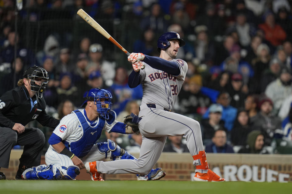 Houston Astros' Kyle Tucker watches his single during the fifth inning of the team's baseball game against the Chicago Cubs, Wednesday, April 24, 2024, in Chicago. (AP Photo/Erin Hooley)