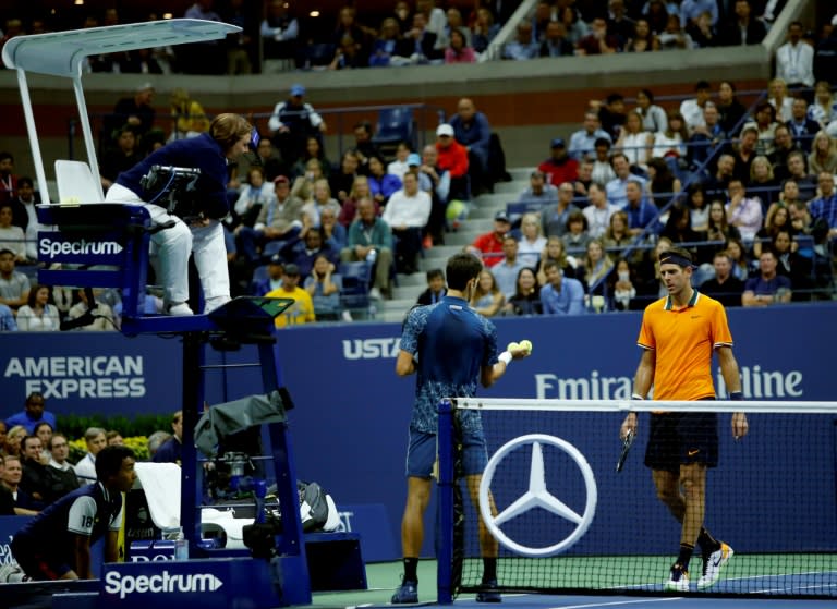 Novak Djokovic asks for balls to be checked while playing Juan Martin del Potro in the US Open final