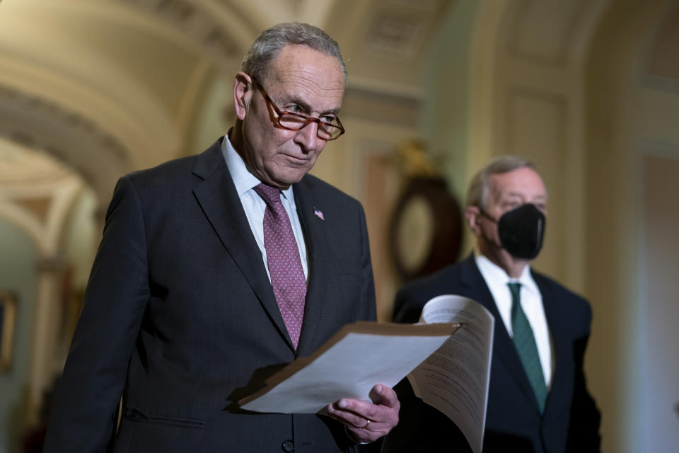 FILE - Senate Majority Leader Chuck Schumer, D-N.Y., joined at right by Majority Whip Dick Durbin, D-Ill., speaks to reporters after a Democratic policy meeting at the Capitol in Washington, Dec. 14, 2021. Senate Democrats who have played defense for the last three Supreme Court vacancies plan to move swiftly to replace retiring Supreme Court Justice Stephen Breyer. In statements, Senate Majority Leader Chuck Schumer and Senate Judiciary Committee Chairman Dick Durbin made clear that they would move quickly once President Joe Biden makes his pick. (AP Photo/J. Scott Applewhite, File)