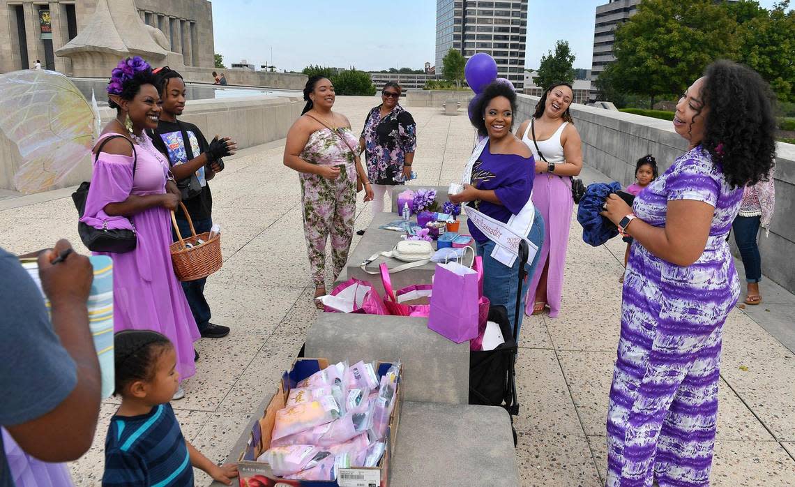 Christa Rice, right, the founder and organizer of the KC Curly Photoshoot, visits with participants as the 6th Annual KC Curly Photoshoot gets underway.